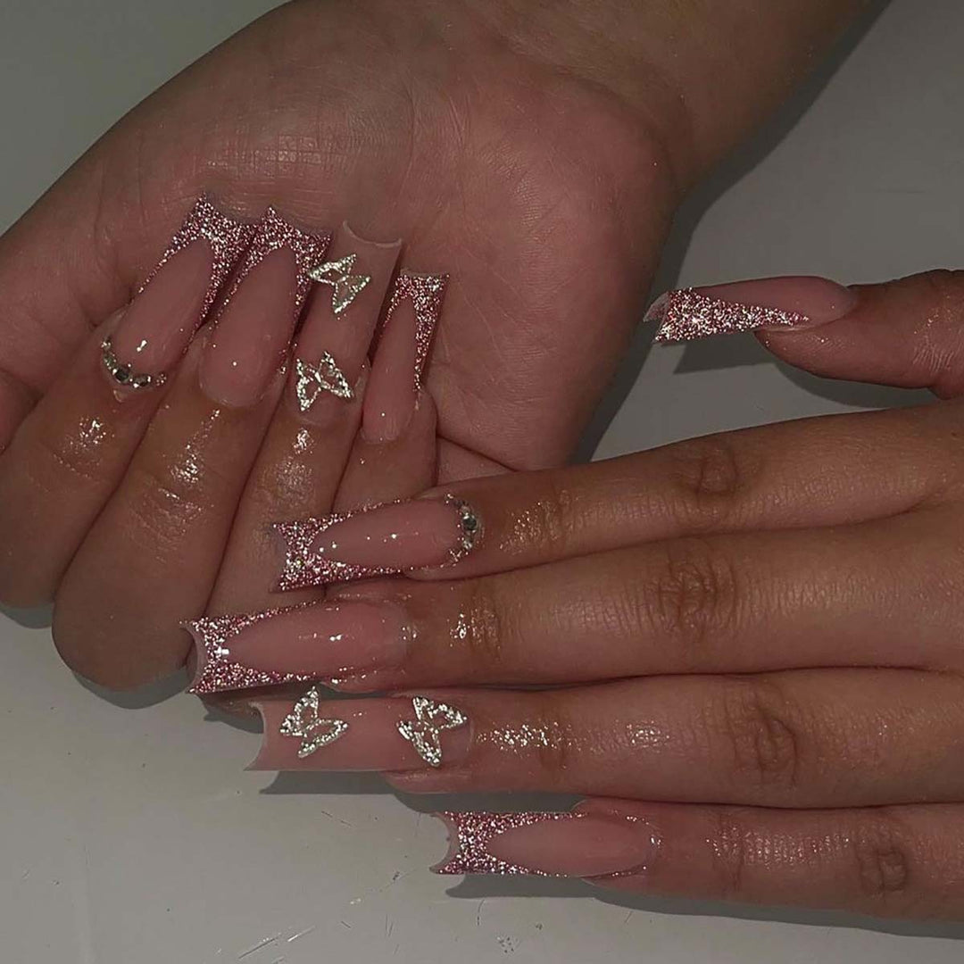 Glamorous stiletto artificial nails with glitter and crystal elements Bowlift
