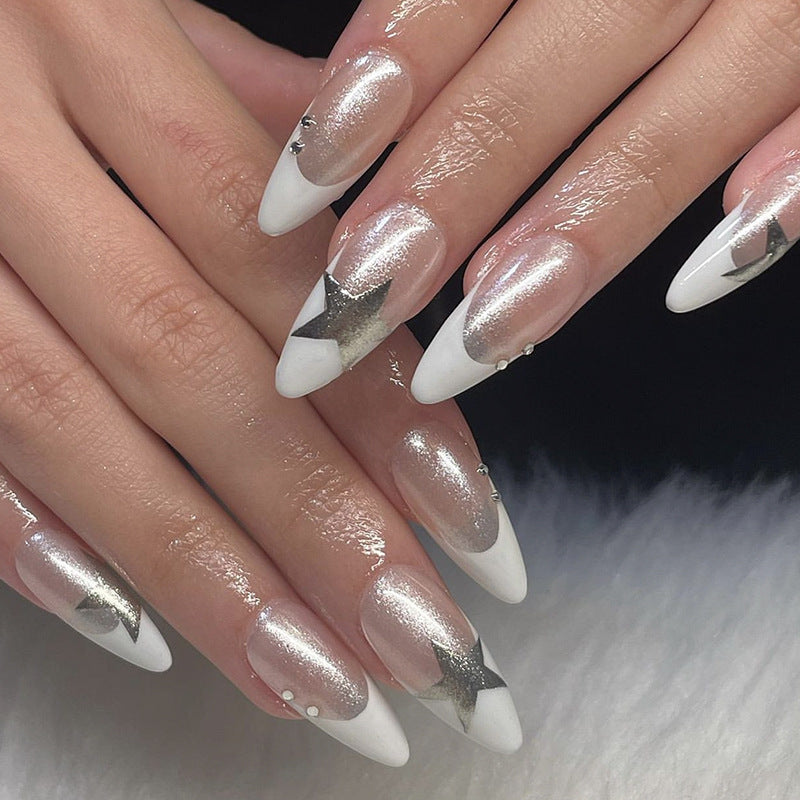 Artful stiletto nails with glitter and star motifs Bowlift