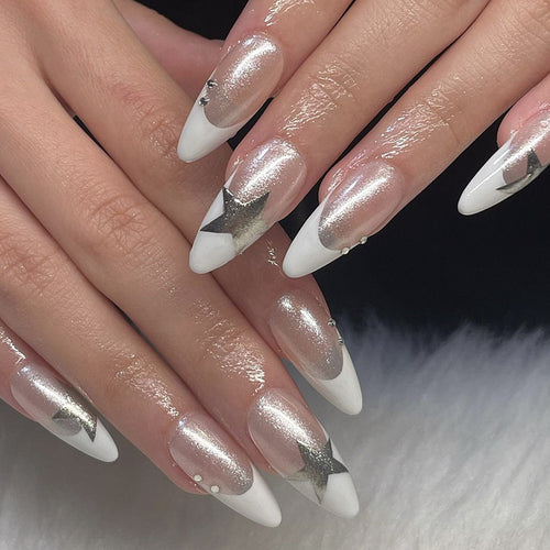 Artful stiletto nails with glitter and star motifs Bowlift