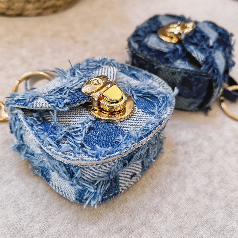 Distressed denim micro crossbody mini purse with gold turn-lock top handle Bowlift