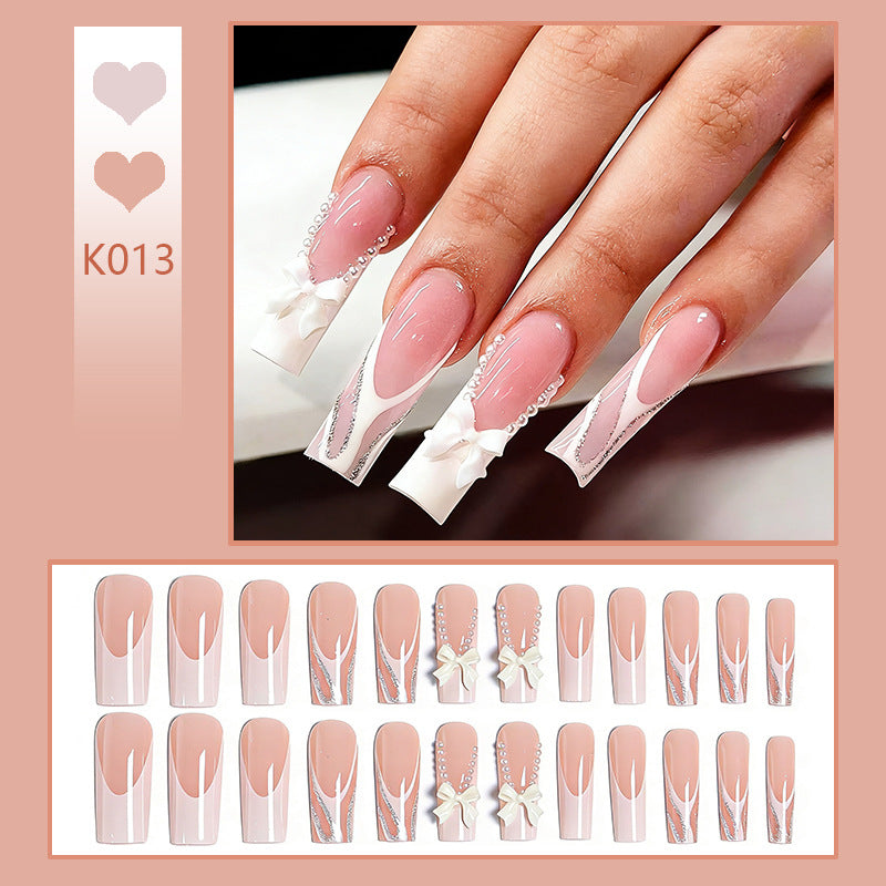 Artificial nail set with elegant bow and pearl decorations Bowlift