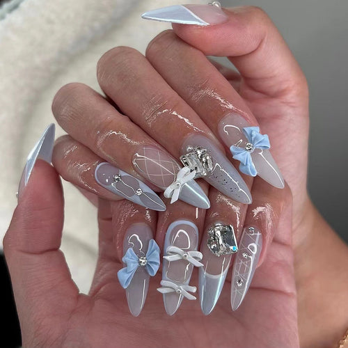 Artistic stiletto nails with elegant jewelry accents Bowlift