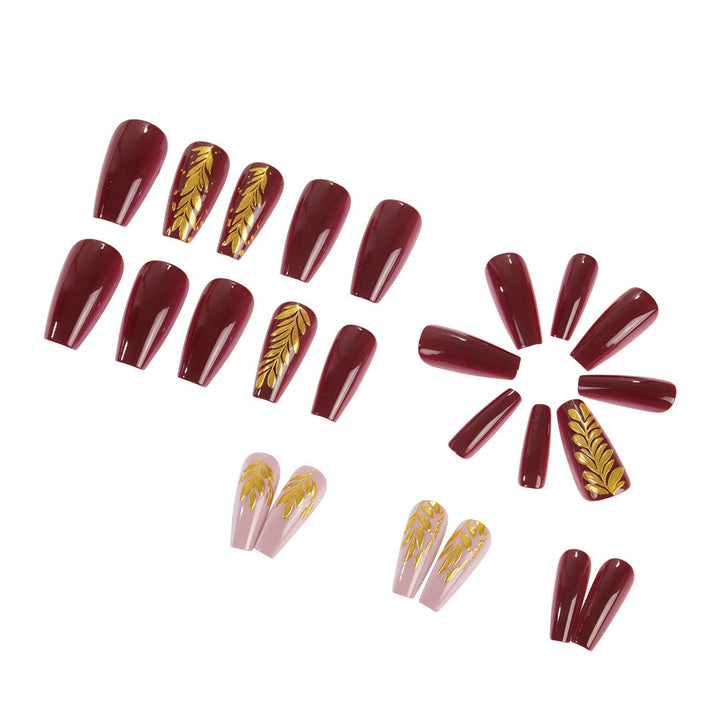 Elegant artificial nails with gold decoration Bowlift