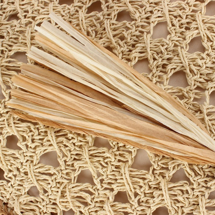 Handbag Made of Hand-Woven Natural Material with Appealing Tassel Detail Bowlift