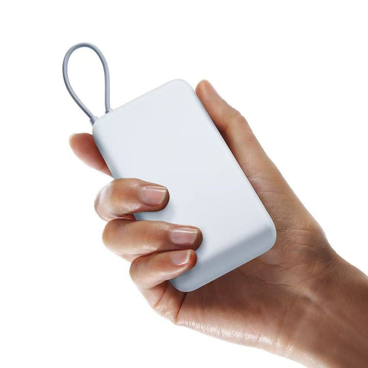 Compact portable High-capacity power bank with integrated charging cables and matte soft-touch finish Bowlift