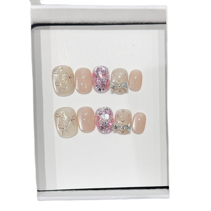 Artificial nails with romantic bow design Bowlift