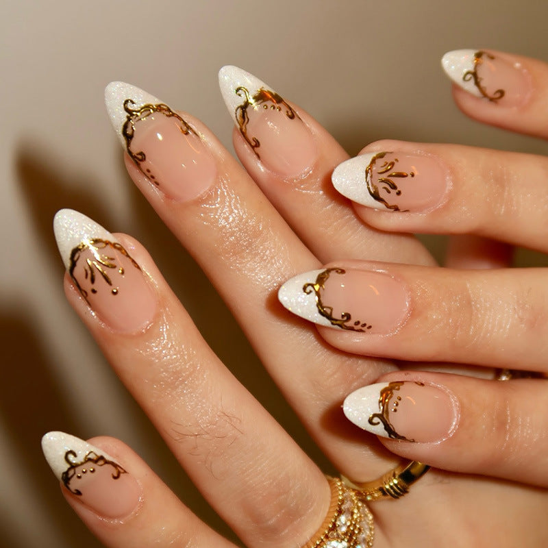 Artificial nail set with elegant gold accents and transparent design Bowlift