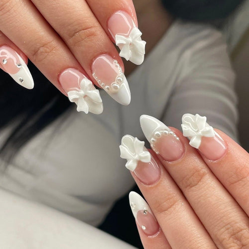 Artful stiletto nails with elegant flower embellishment Bowlift