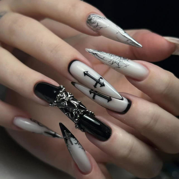 Artistic stiletto nails with unique 3D details and elegant accents Bowlift