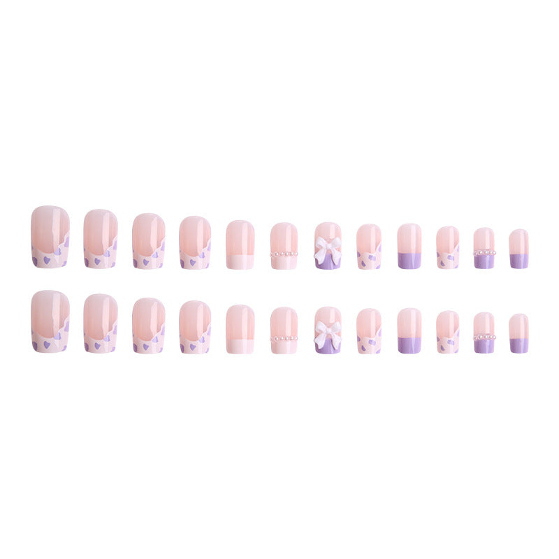 Nail art set with elegant wave patterns and delicate pearl accents Bowlift