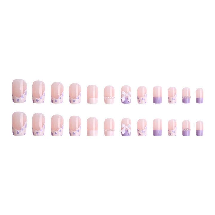 Nail art set with elegant wave patterns and delicate pearl accents Bowlift