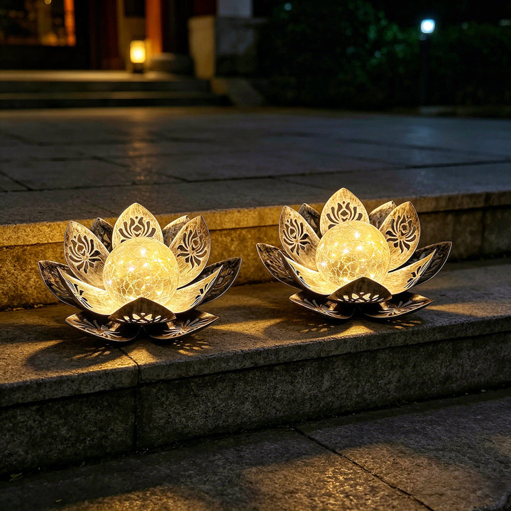 Decorative lotus solar garden light with antique metal petals and cracked glass globe Bowlift