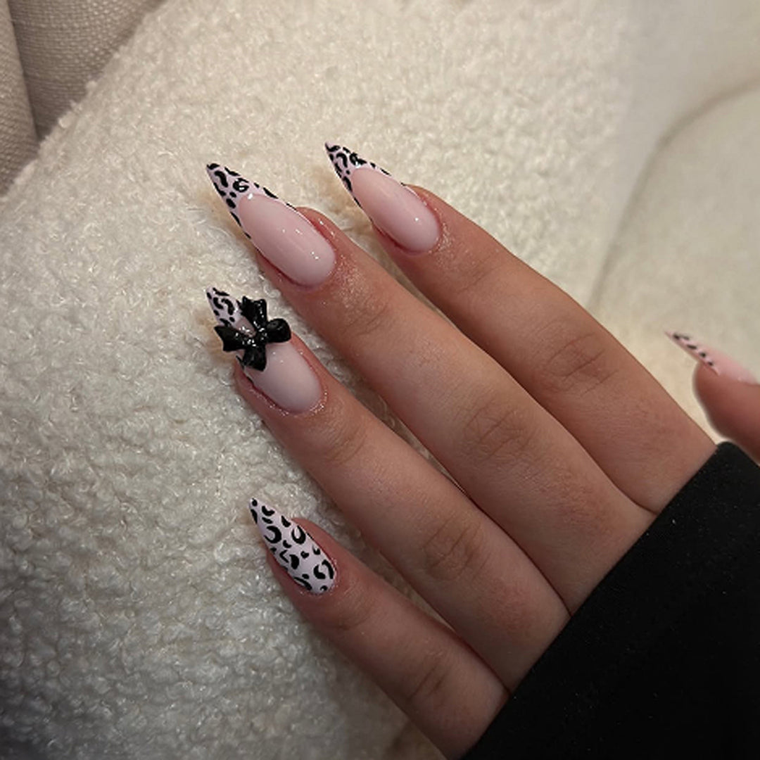 Artful Stiletto Nails with Leopard Print and Bow Accent Bowlift