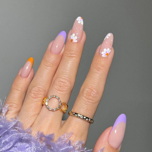 Artful nail art with floral accents and gradient colors Bowlift