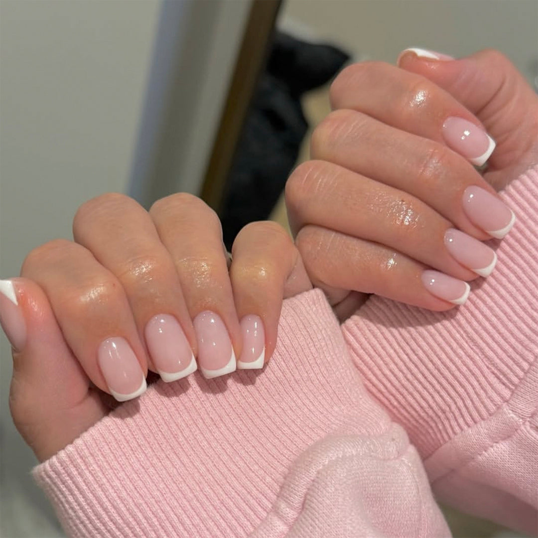 Elegant high-gloss nail art with French design Bowlift