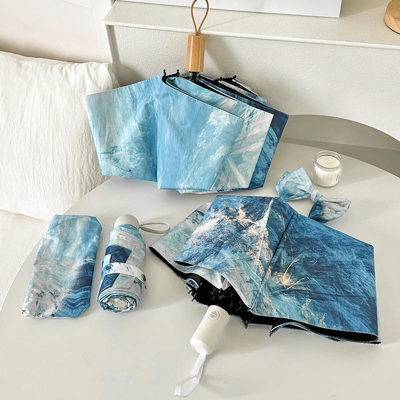 Ladies elegant folding umbrella with unique marble pattern Bowlift