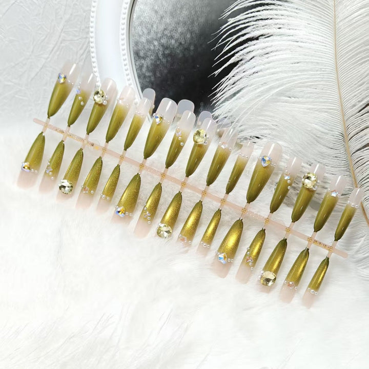Artificial nail set with glamorous jewelry embellishments Bowlift