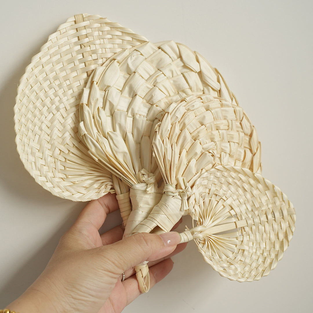 Women handmade fan made of natural material Bowlift