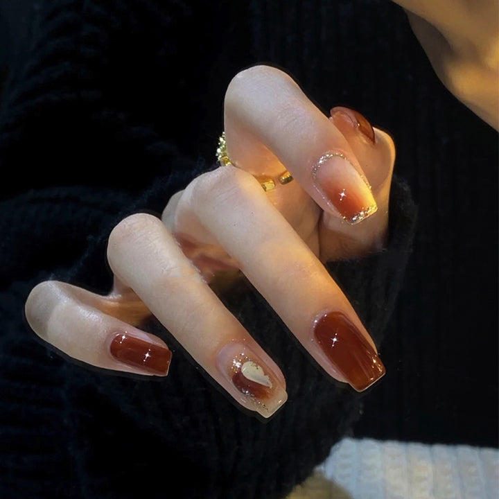 Elegant Glossy Press-On Nails with Gold Glitter Accents Bowlift