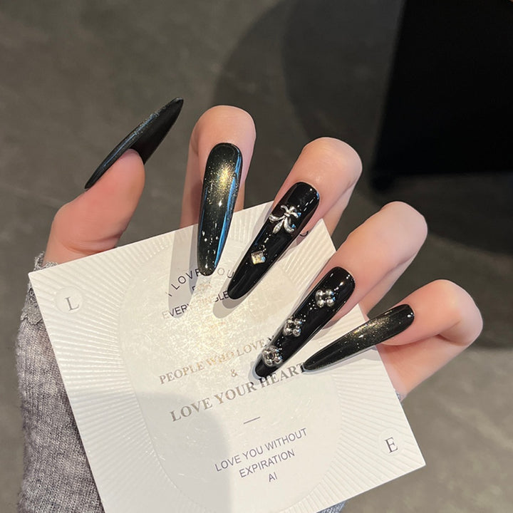 Artistic Stiletto Press-On Nail Art with Glimmering Accents Bowlift