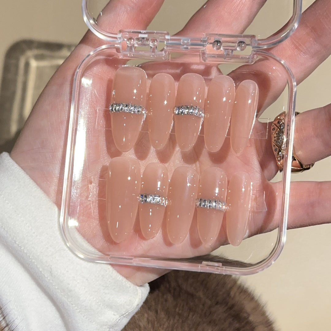 Glamorous artificial nails with rhinestones Bowlift