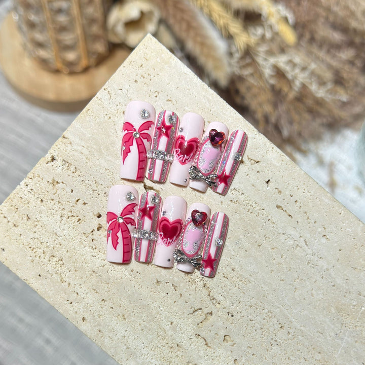 Artistic Press-On Nail Set with Playful Heart and Palm Designs Bowlift