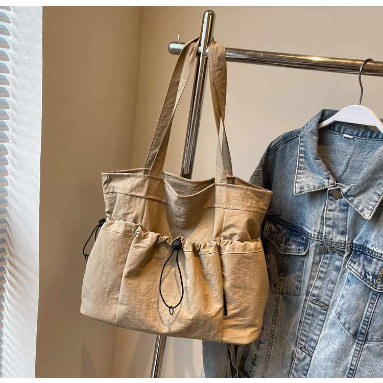 Practical everyday handbag with drawstring Bowlift