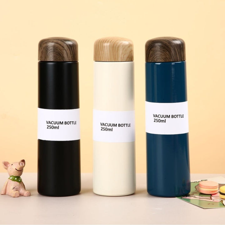 Women vacuum-insulated water bottle with innovative wooden lid Bowlift
