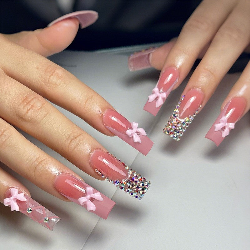 Glamorous artificial nail set with sparkling rhinestones and cross decorations Bowlift