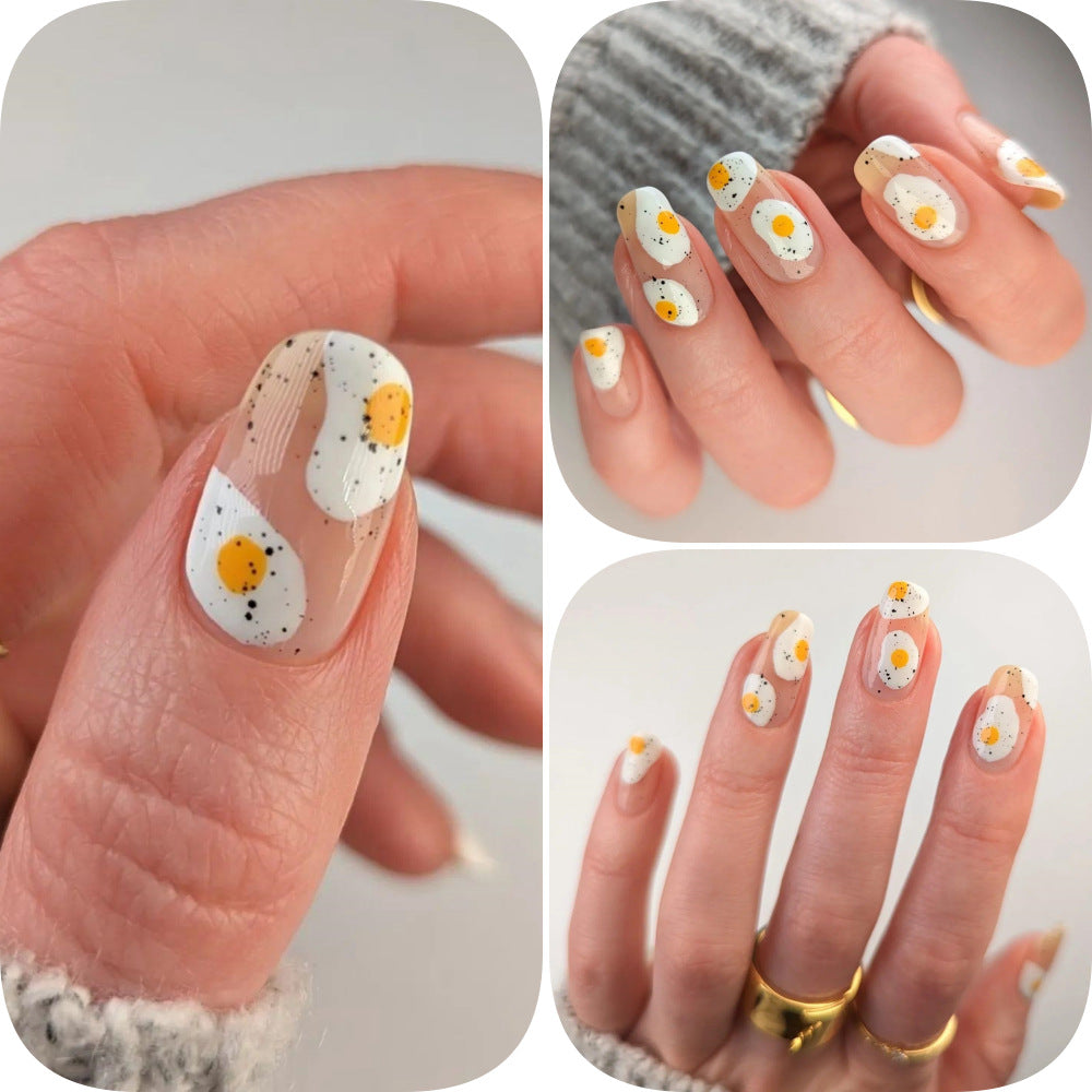 Artificial nails in creative fried egg design Bowlift