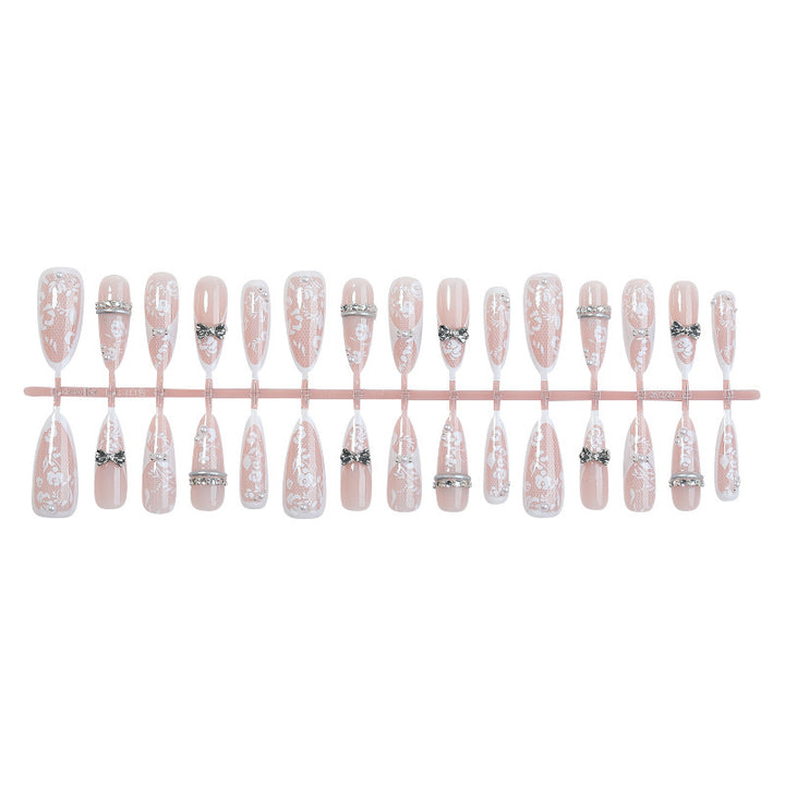 Artificial nail set with romantic floral design and sparkling accents Bowlift