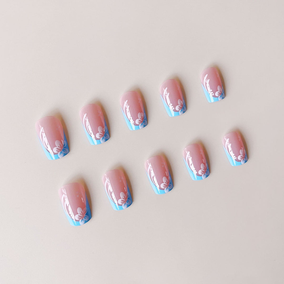 Acrylic nail set with floral designs and elegant tips Bowlift
