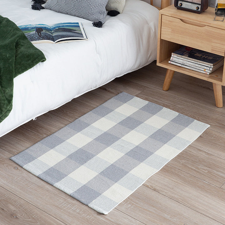 Woven colorful table runner with fringes and checkered structure