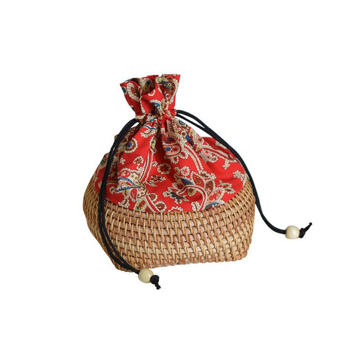 Charming storage bag made of hand-woven rattan Bowlift