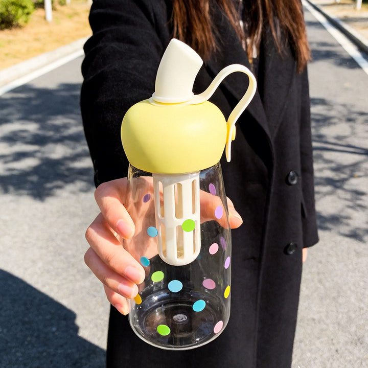 Women's water bottle with integrated fruit filter and practical carrying handle Bowlift