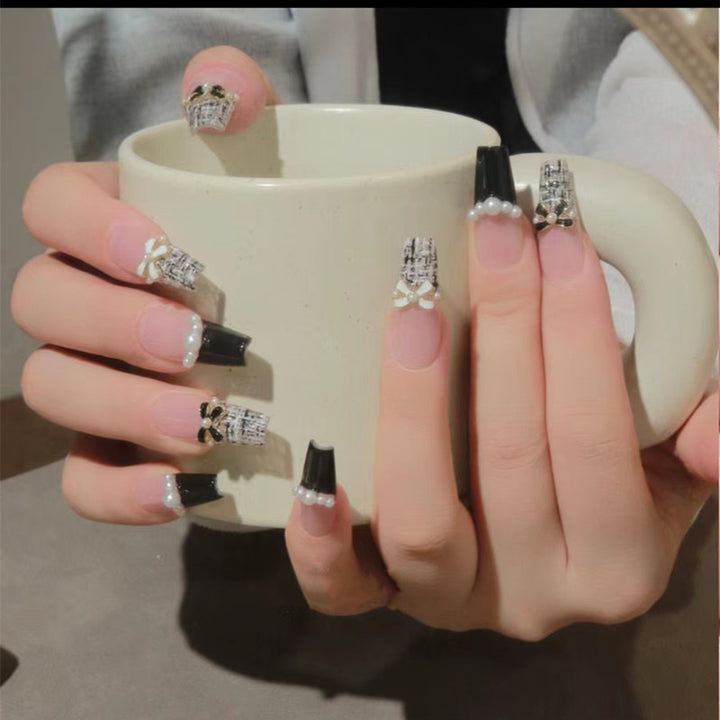 Glamorous nail designs with pearl and rhinestone accents Bowlift