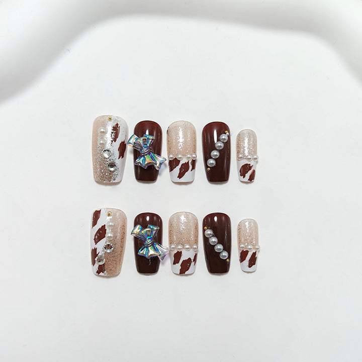 Artificial nails with glamorous rhinestone and bow design Bowlift