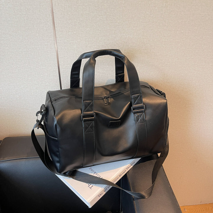Sporty duffel bag with durable water-repellent material and versatile carrying options Bowlift