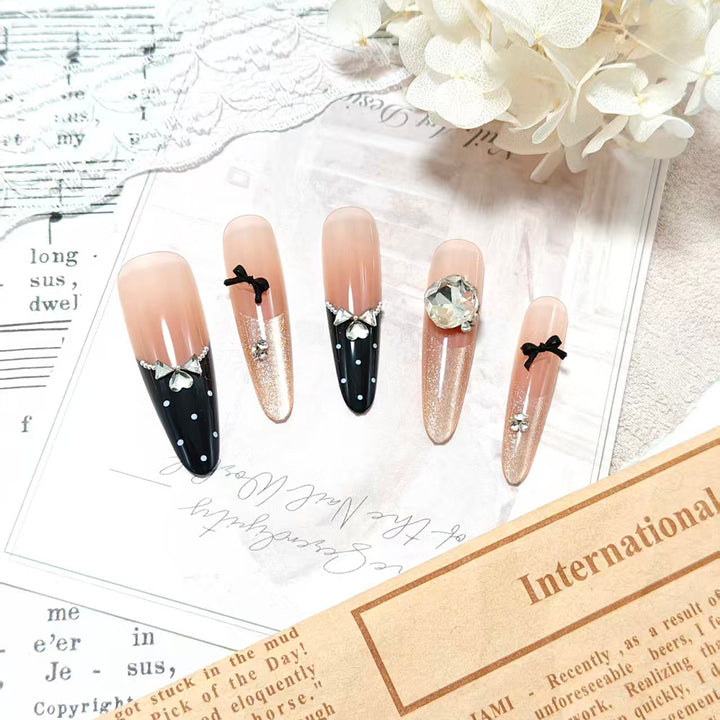 Stylish glitter accent artificial nails with elegant detailing Bowlift