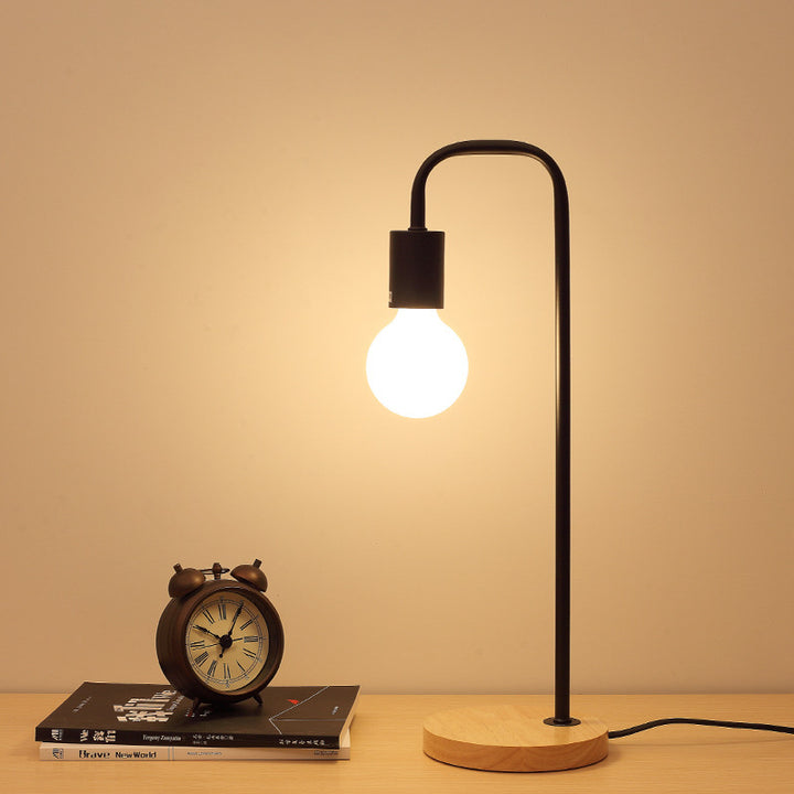 Minimalist Curved-Arm Table Lamp with Round Base and Standard Bulb Socket Bowlift
