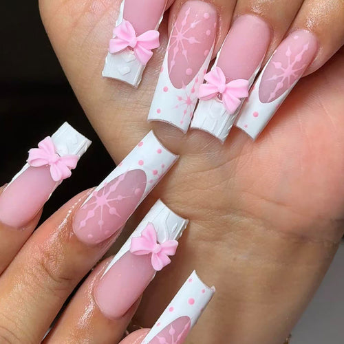 Artificial nail tips with playful bows and snowflake design Bowlift