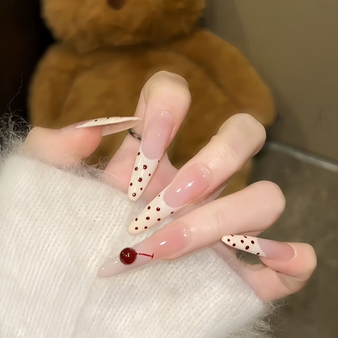 Artificial nails with playful design and cherry accents Bowlift