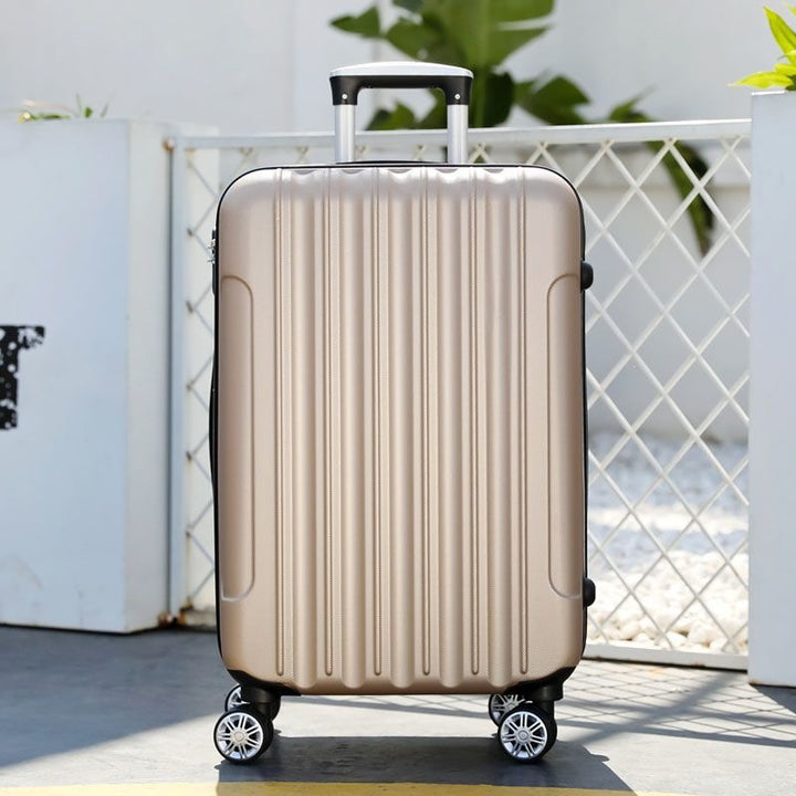 Hard shell suitcase with 360-degree wheel system and integrated safety feature Bowlift