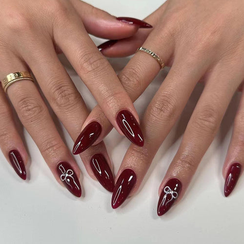 Elegant Stiletto Press-On Nail Extensions with Artistic Design Bowlift