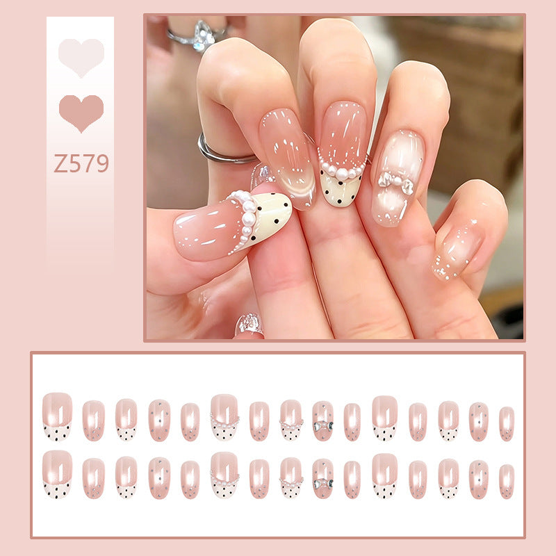 Artificial nail set with elegant French design and delicate pearl embellishments Bowlift
