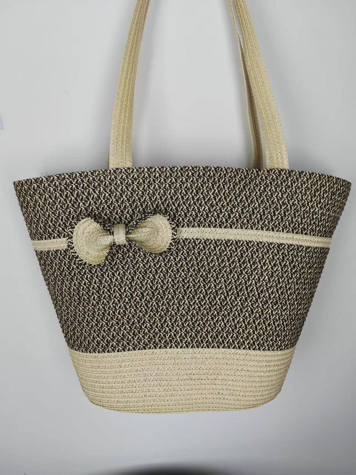 Elegant straw bag with decorative bow closure Bowlift