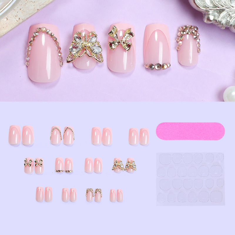 Glamorous artificial nail set with floral accents and glitter decorations Bowlift