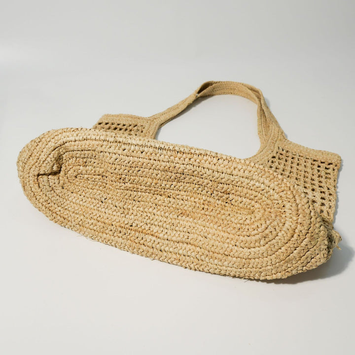 Hand-knotted raffia bag with generous interior Bowlift
