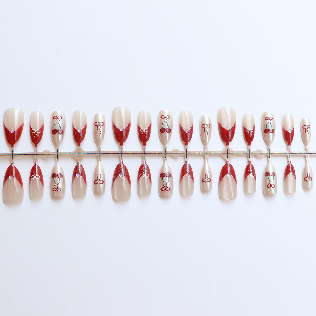 Artistic Press-On Nail Set with Cherry and Ribbon Design Bowlift