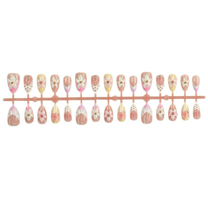 Nail art set with elegant floral design and glitter accents Bowlift